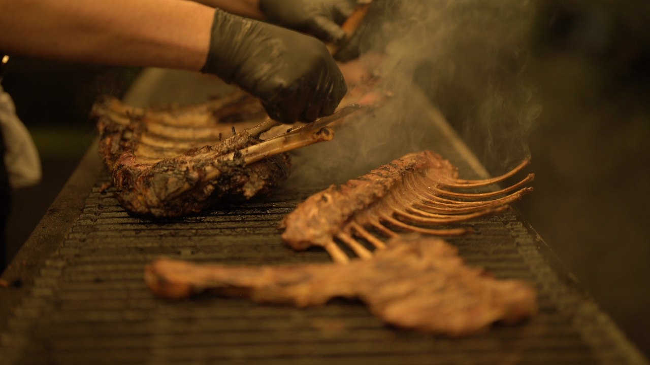 Premium barbecue with grilled meats, vegetables, and sauces