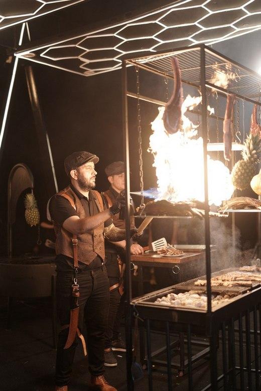 Premium barbecue with grilled meats, vegetables, and sauces