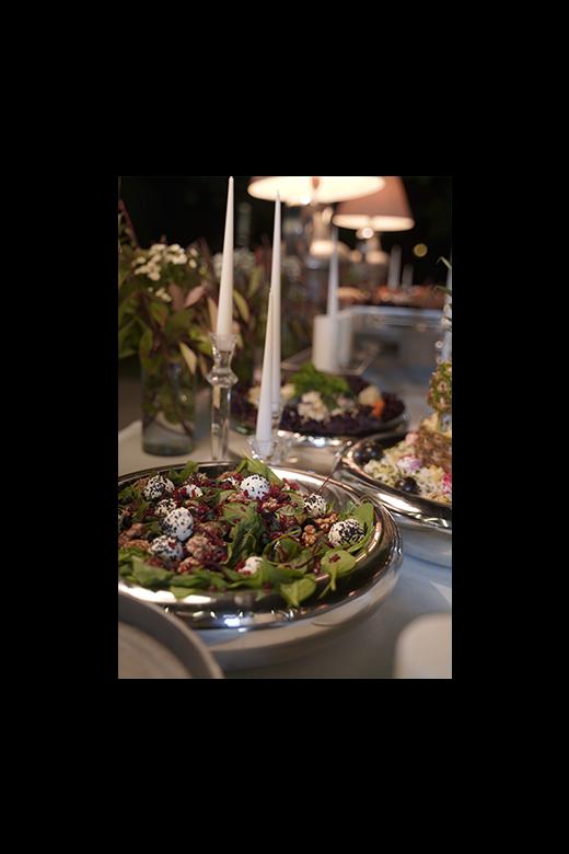 Fresh salad with greens, tomatoes, and dressing