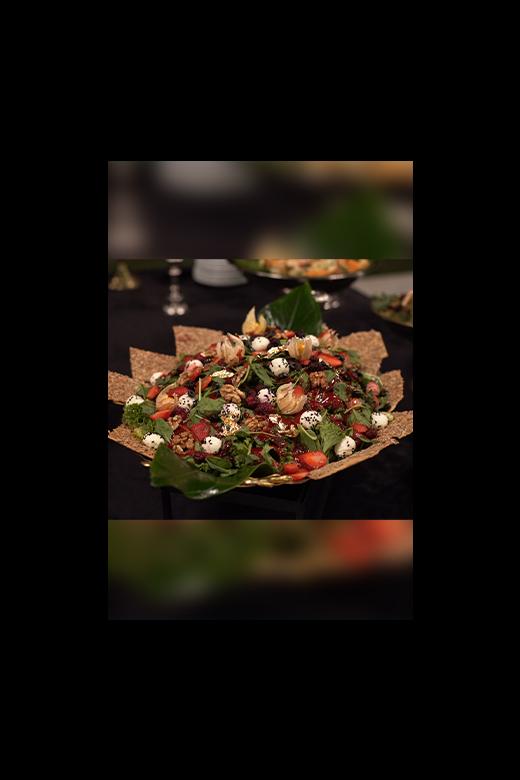 Fresh salad with greens, tomatoes, and dressing