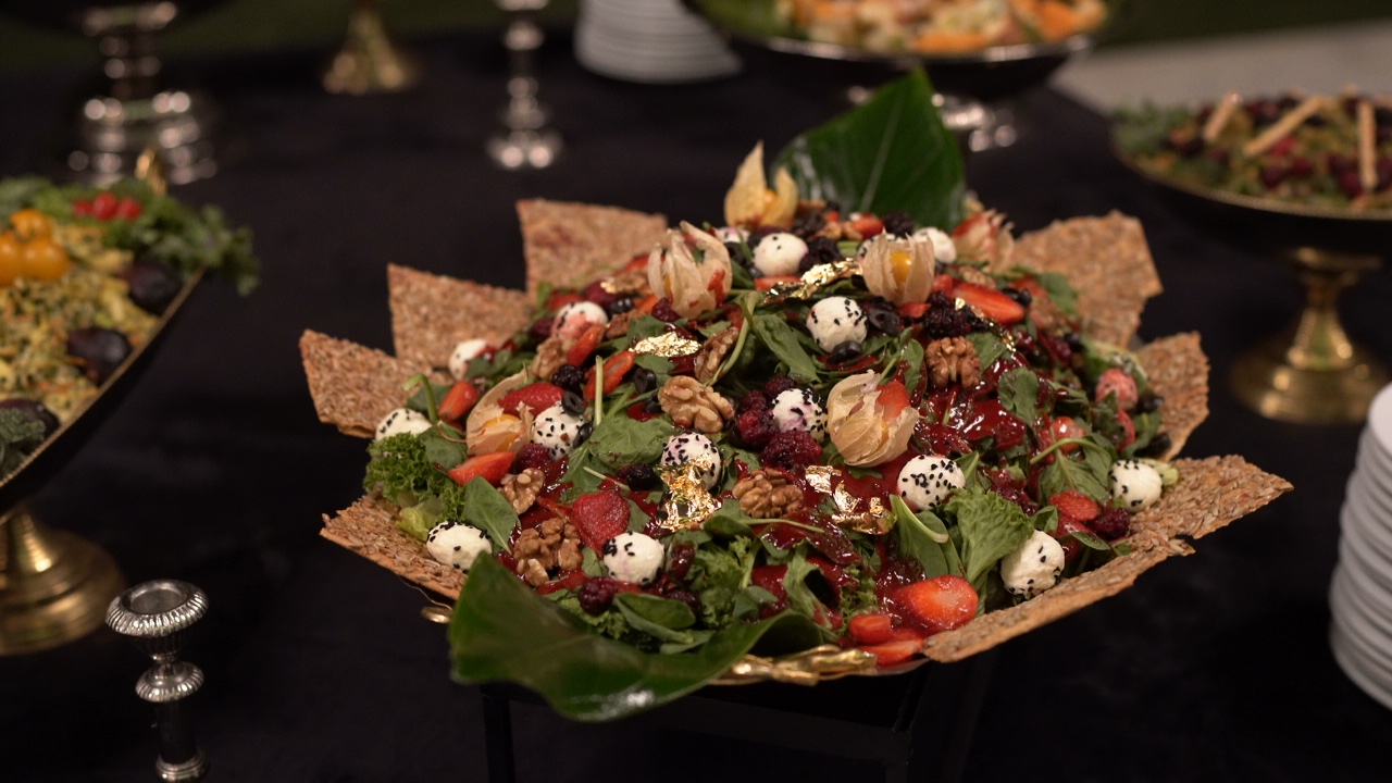 Fresh salad with greens, tomatoes, and dressing